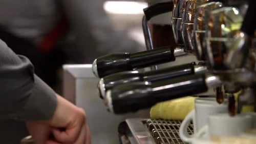 Barista Making Espresso at a Cafe