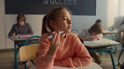 Clever Kid Raising Hand During Lesson At Elementary School. Cute Student Answering For Question. ...