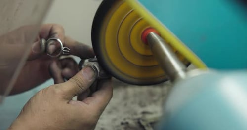 Jeweler Polishes a Ring During the Making Process in a Workshop