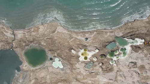 Top aerial view of rock pools in the Dead Sea