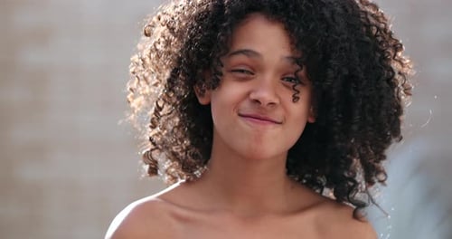 Happy mixed race preteen girl portrait face close-up