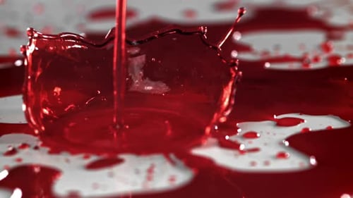 Drops of Blood Fall on the Table Filmed on a Highspeed Camera at 1000 Fps