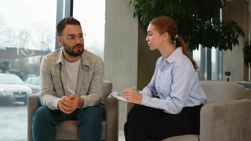 Man and Woman Discussing Issues in Counseling Session