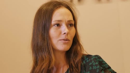 Camera Shows Pretty Woman Talking to Boyfriend in Fashion Store