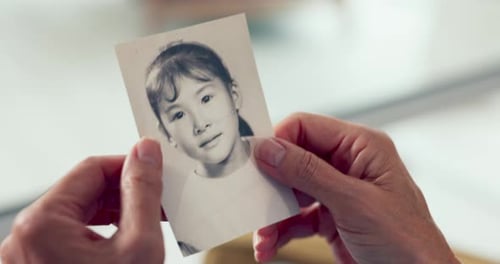 Hands Holding Nostalgic Black and White Childhood Photo