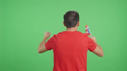 Rear View of a Man Waving a Puerto Rican Pennant
