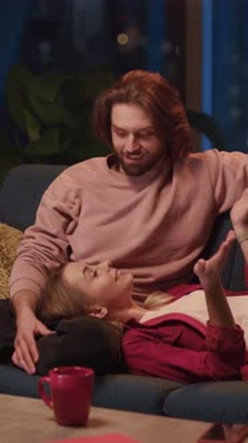 Woman Lying on Her Boyfriend Knees Taling About Daily News Communicating on Cozy Late Evening