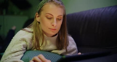 Woman Working on Digital Tablet Browsing Social Media