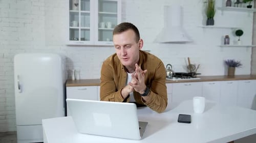 Young Adult Video Call in Modern Kitchen