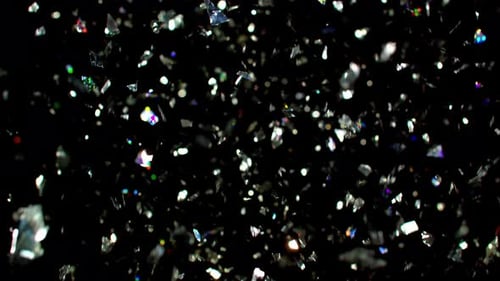Silver Glitter and Confetti Falling on Black