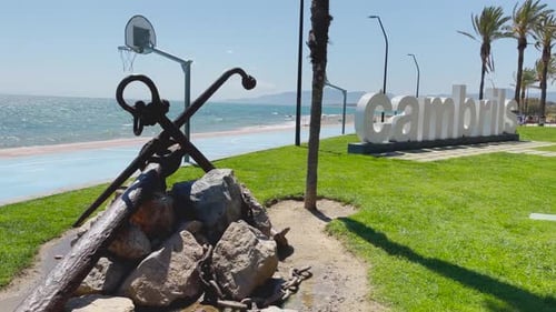 Cambrils beach in Barcelona Catalonia Spain poster white letters anchor view of the turquoise blue s