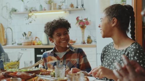 Family Enjoys Meal Together in Bright Kitchen
