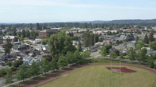 Houses Near The Football Field In Puyallup, Washington - aerial drone