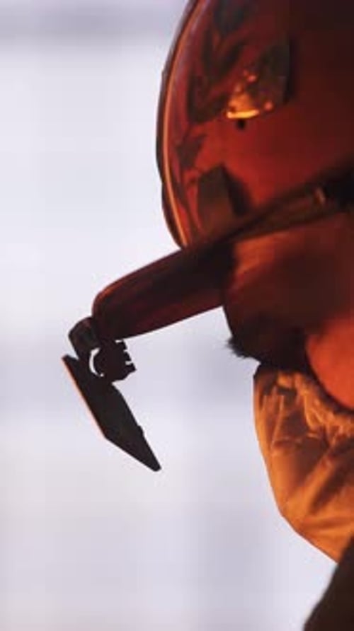 Industrial Worker in Action A Portrait of Grit Determination and Unwavering Commitment Stock Clip