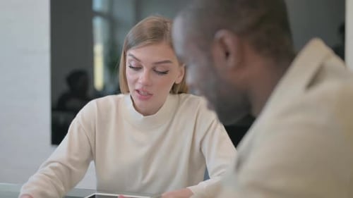 Close up of Young Female Talking with African Man