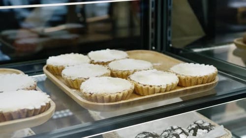 Counter full of delicious buns and pastries in a shop, bakery