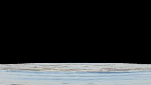 Falling drop of water into a pool with splash wave and ripples