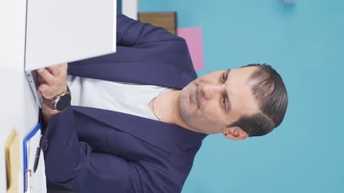 Professional Man Smiling After Working At Computer