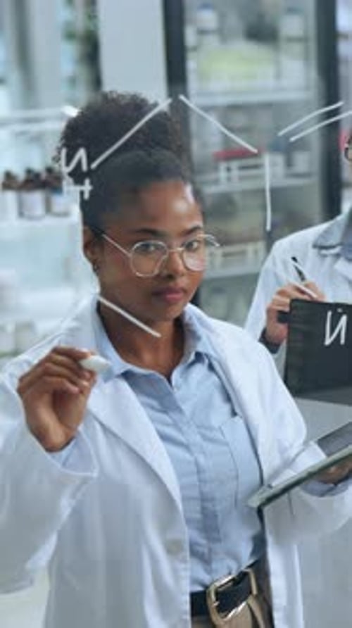Scientist, tablet and woman writing by board in lab for formula, problem solving and physics