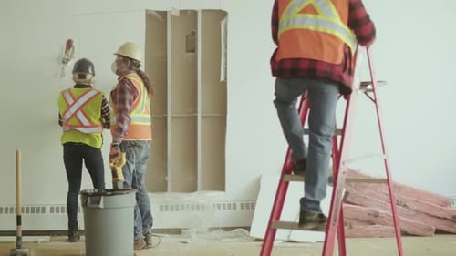 Construction Workers on Office Renovation Site Adult