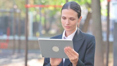 Portrait of Business Woman Using Tablet Outdoor