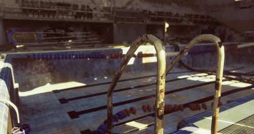 Abandoned Swimming Pool Shows Signs of Decay and Neglect in an Indoor Setting