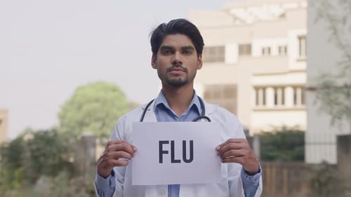 Doctor Holds Sign About the Flu in City