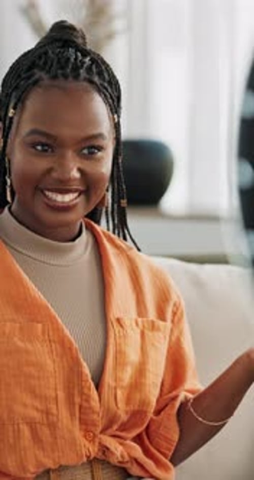 Woman Talking and Smiling On Sofa