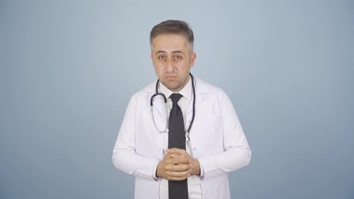 Worried Doctor Speaks in Studio Mid Shot