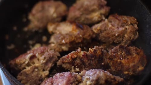 Meatballs fried in a pan. Cooking meat at home