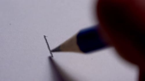 Writing Hello on Paper with Pencil