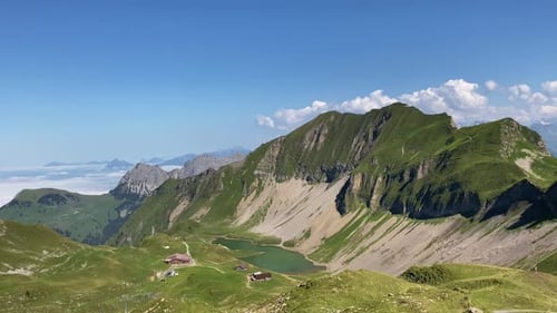 Sunlit clouds in Swiss Alps pass, panorama from Eiseesattel, Rothorn trekking trail