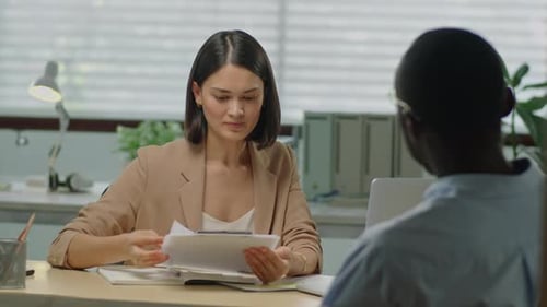 Female HR Manager Having Meeting with Job Applicant in Office