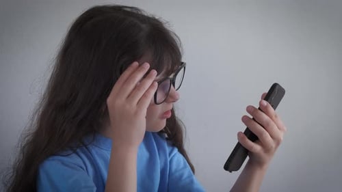 Girl with Glasses Using Mobile Smart Phone