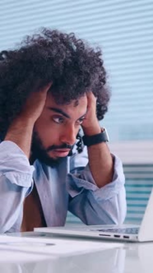 Frustration Builds As the Clock Ticks During a Work Deadline in the Office