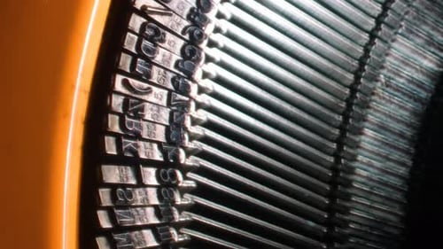 Writing letters with orange retro vintage typewriter