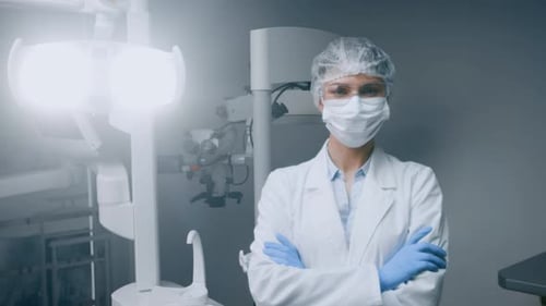 Dentist in Modern Clinic Preparing for Patient Consultation