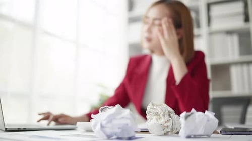 Business Woman seriously stressed working and headache due to office syndrome.