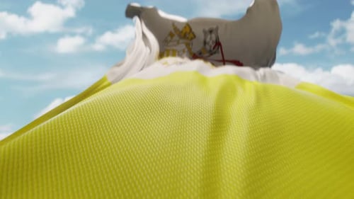 Realistic Waving Vatican City Flag Against Blue Sky
