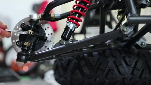 Workers are Making a Motorcycle in the Workshop Preparing the ATV for Sale