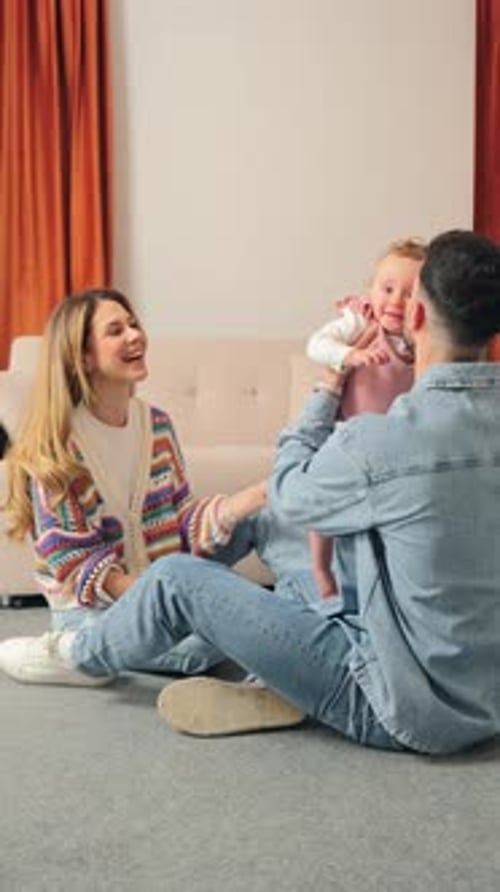 Loving Family Playing with Baby at Home