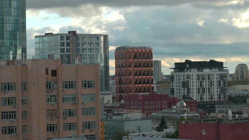 Top view of modern buildings and facades of city. Stock footage. Beautiful view of city between mode