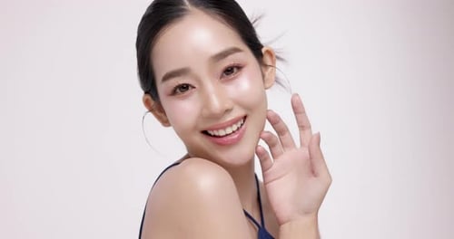 Slow motion of beautiful young Asian girl with k-beauty make up style.