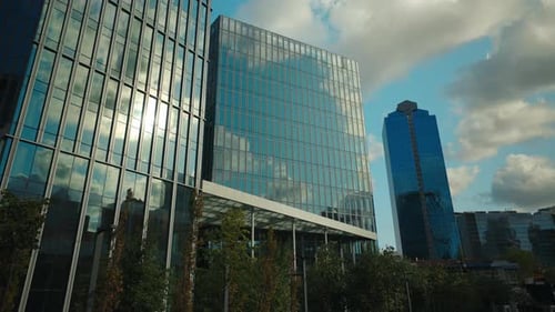 Picturesque Cloudscape Reflected By Office Buildings Facades in City Downtown