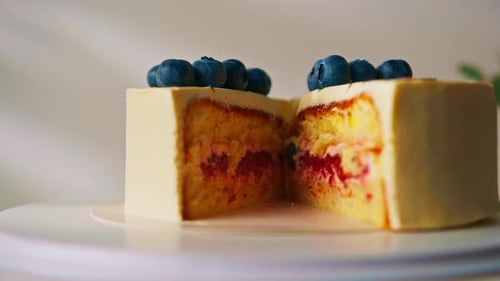 Dessert Cake Cut in Half with Blueberries