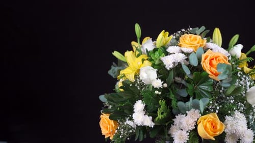 Yellow and green bouquet slider shot roses chrysanthemum lily black background