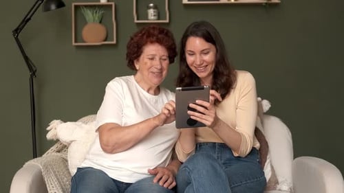Generations Connect Using Tablet at Home Together