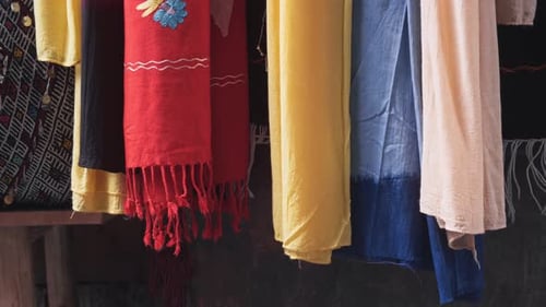 Handmade vibrant linen fabrics in Morocco market, handheld view