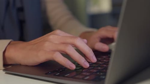 Asia muslim freelancer women wear hijab casual cloth finger typing keyboard laptop at home office.