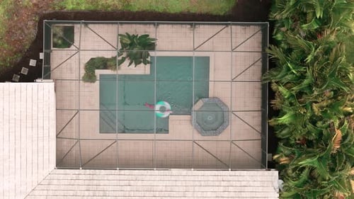 Wide Aerial Above View of Screened in Pool and Lanai in Florida House Top Down Shot